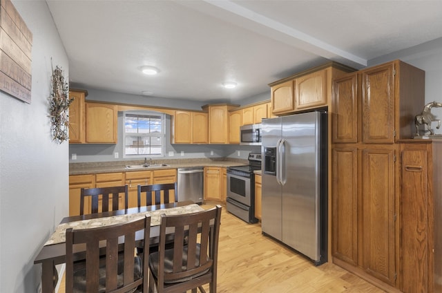 208 40th Ave NE, Great Falls, MT 59404 - kitchen with light wood-type flooring, a sink, light countertops, stainless steel appliances, and recessed lighting