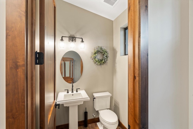 14 Marina Crest Ln, Whitefish, MT 59937 - bathroom featuring visible vents, baseboards, and toilet
