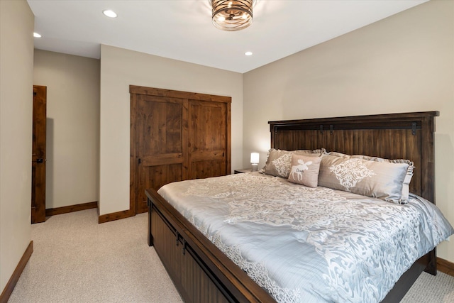14 Marina Crest Ln, Whitefish, MT 59937 - bedroom with baseboards, recessed lighting, a closet, and light carpet