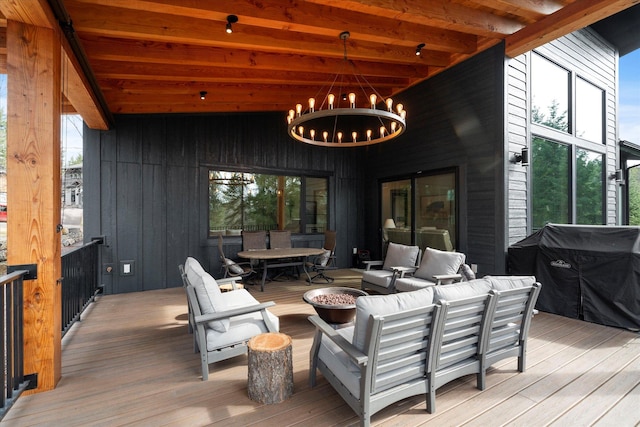 14 Marina Crest Ln, Whitefish, MT 59937 - wooden terrace with outdoor dining area and an outdoor living space
