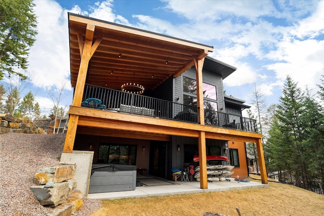 14 Marina Crest Ln, Whitefish, MT 59937 - back of house featuring a patio and a balcony