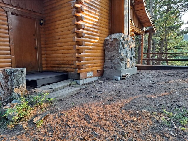 exterior space with fence and log siding