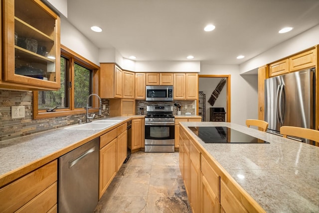 kitchen with glass insert cabinets, recessed lighting, a sink, backsplash, and stainless steel appliances