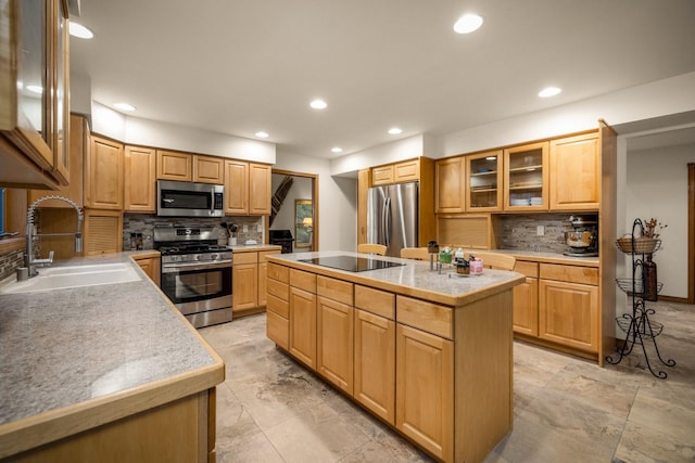 kitchen with a kitchen island, recessed lighting, tasteful backsplash, a sink, and stainless steel appliances