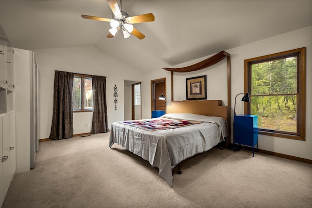 bedroom with light colored carpet, baseboards, ceiling fan, and lofted ceiling