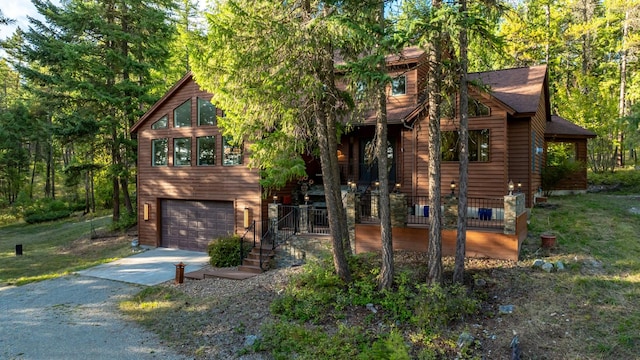 145 Little Mountain Ln, Whitefish, MT 59937 - rustic home with driveway and an attached garage