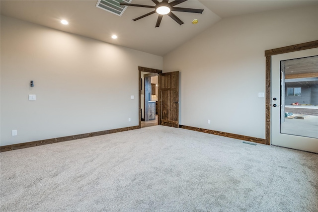 unfurnished room with carpet floors, ceiling fan, vaulted ceiling, and visible vents