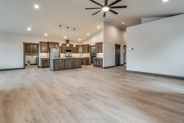 unfurnished living room featuring visible vents, baseboards, high vaulted ceiling, recessed lighting, and a ceiling fan