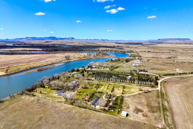 bird's eye view featuring a water and mountain view and a rural view