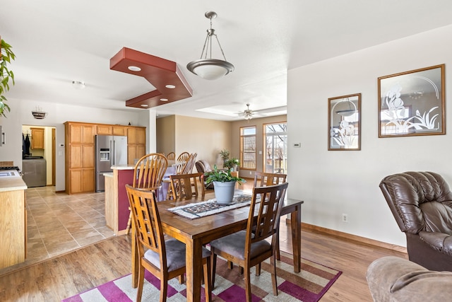 dining space featuring baseboards, washer / clothes dryer, ceiling fan, recessed lighting, and light wood-style flooring