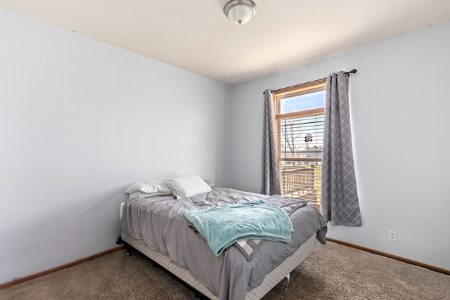 carpeted bedroom with baseboards