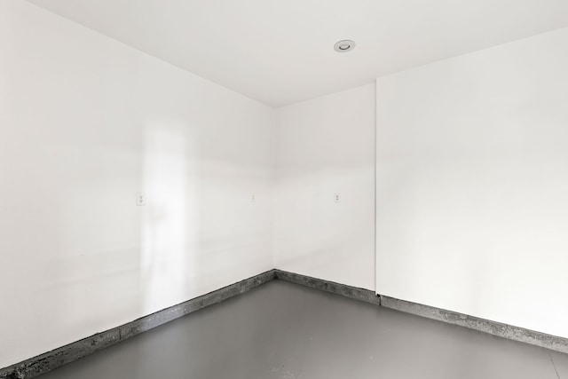 spare room with concrete flooring