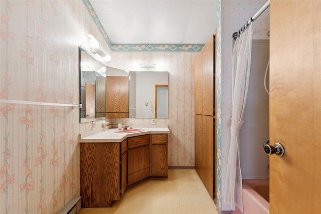full bathroom featuring vanity, wallpapered walls, and shower / tub combo with curtain