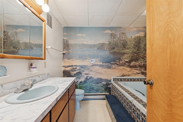 bathroom with visible vents, a drop ceiling, toilet, and vanity