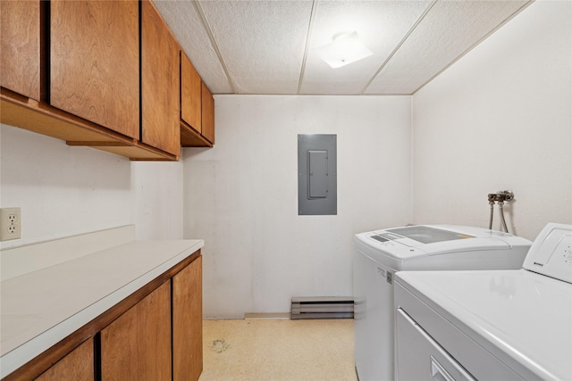 535 Reservoir Rd, Whitefish, MT 59937 - laundry area featuring electric panel, washing machine and dryer, cabinet space, a baseboard radiator, and light floors