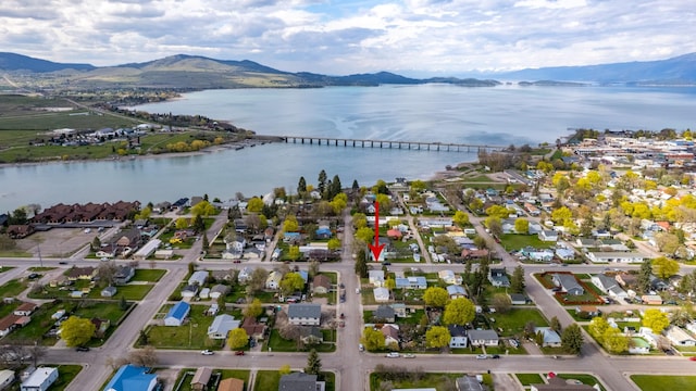 birds eye view of property featuring a residential view and a water and mountain view