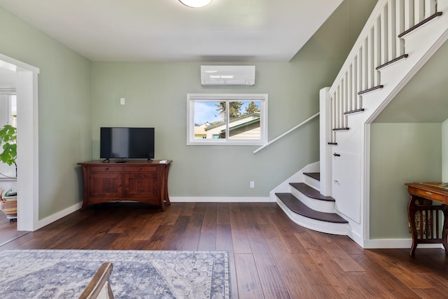 interior space with baseboards, a wall mounted air conditioner, hardwood / wood-style flooring, and stairway