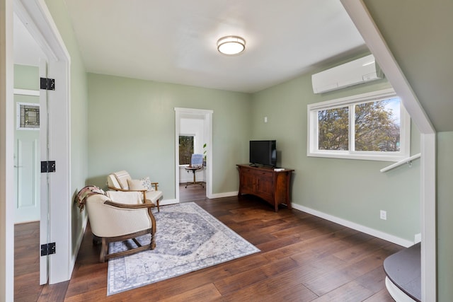 309 7th Ave W, Polson, MT 59860 - sitting room featuring a wall mounted air conditioner and dark wood-style flooring