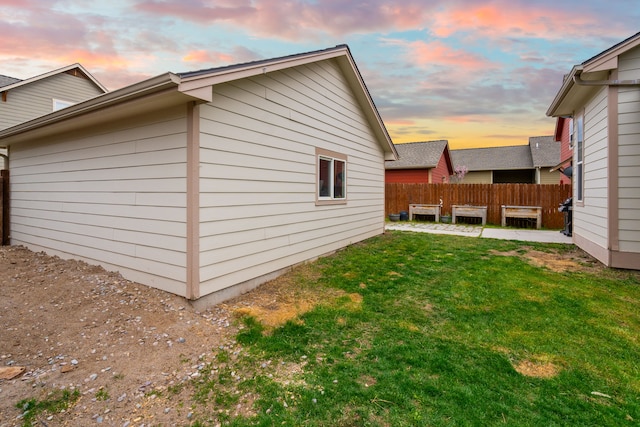 4217 Bordeaux Blvd, Missoula, MT 59808 - view of property exterior featuring a lawn, a patio area, and fence