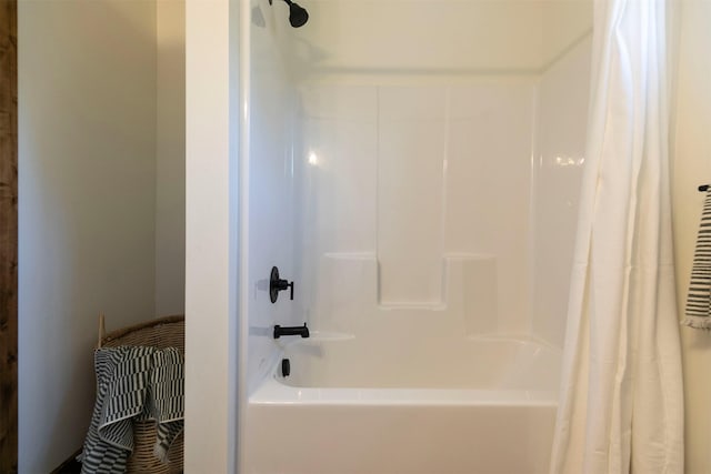 bathroom with shower / bath combination with curtain