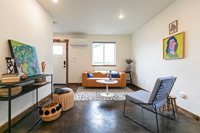 sitting room featuring baseboards, a wall mounted air conditioner, finished concrete floors, and recessed lighting
