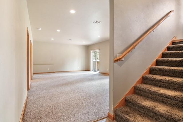 stairway featuring baseboards, carpet flooring, recessed lighting, and visible vents