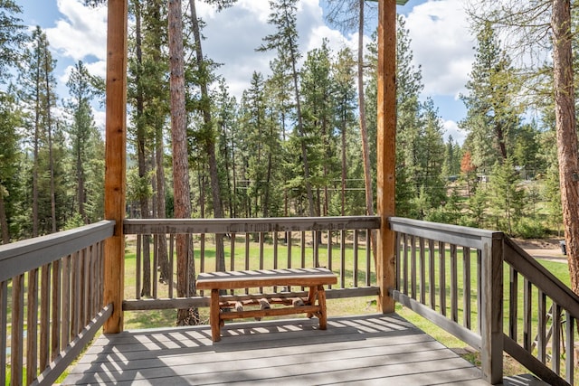 wooden terrace with a forest view