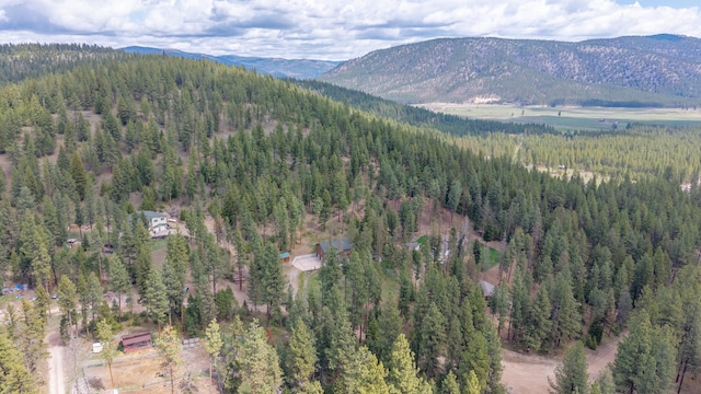 bird's eye view featuring a view of trees and a mountain view