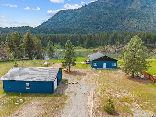 29 Shoreline Dr, Thompson Falls, MT 59873 - view of subject property with a heavily wooded area and a water and mountain view