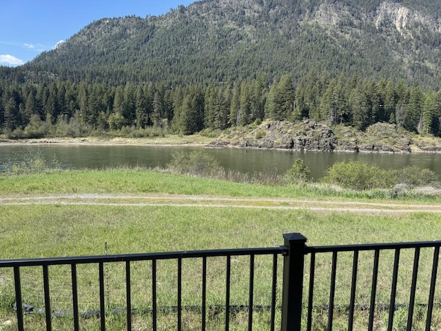29 Shoreline Dr, Thompson Falls, MT 59873 - view of mountain backdrop featuring a heavily wooded area and a large body of water