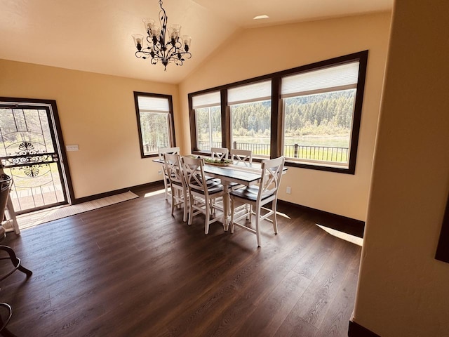 29 Shoreline Dr, Thompson Falls, MT 59873 - dining room with baseboards, a chandelier, lofted ceiling, and dark wood-type flooring