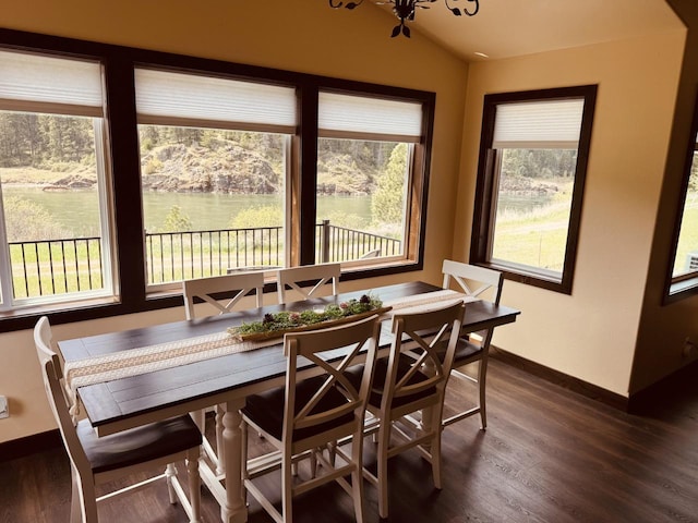 29 Shoreline Dr, Thompson Falls, MT 59873 - dining room with dark wood-style floors, baseboards, lofted ceiling, and a chandelier