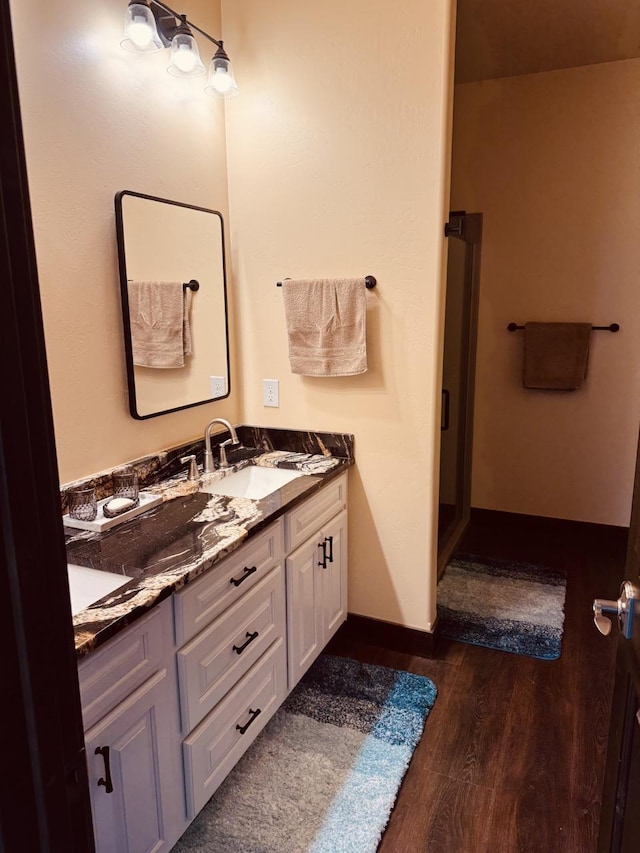 29 Shoreline Dr, Thompson Falls, MT 59873 - bathroom featuring wood finished floors and double vanity