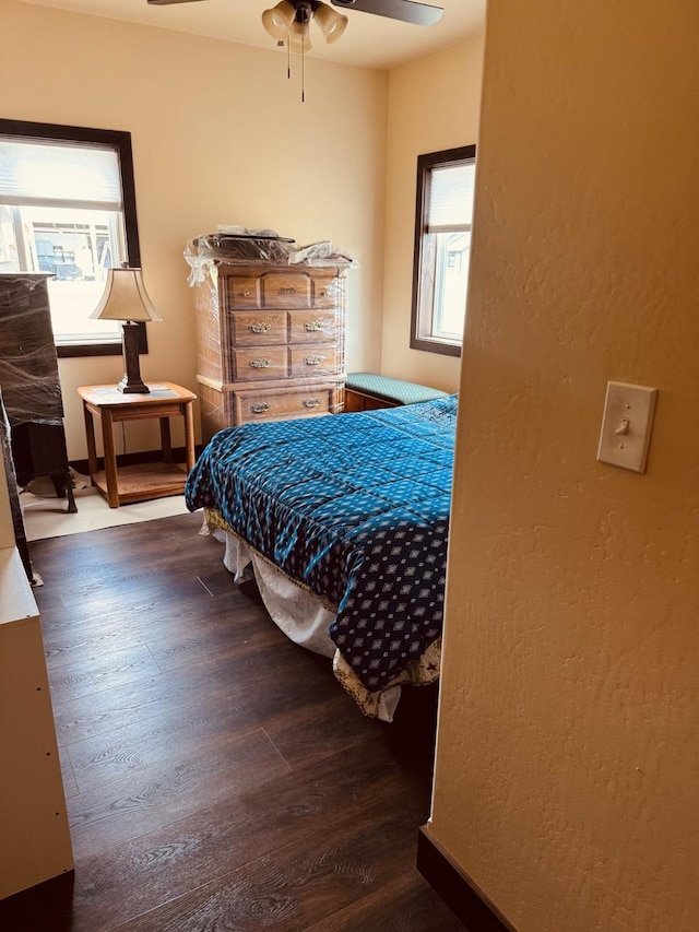 29 Shoreline Dr, Thompson Falls, MT 59873 - bedroom featuring wood finished floors, a textured wall, and ceiling fan