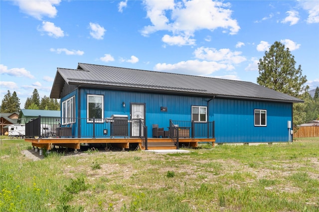 29 Shoreline Dr, Thompson Falls, MT 59873 - back of property with metal roof and a wooden deck