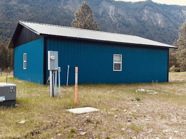 29 Shoreline Dr, Thompson Falls, MT 59873 - view of property exterior featuring a mountain view and metal roof