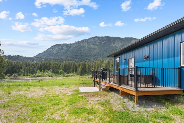 29 Shoreline Dr, Thompson Falls, MT 59873 - view of yard featuring a forest view and a deck with water view