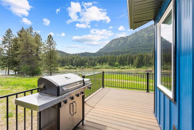 29 Shoreline Dr, Thompson Falls, MT 59873 - wooden deck with a wooded view and a mountain view