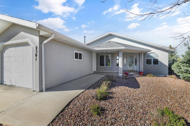 2301 Larkspur Ln, Great Falls, MT 59404 - ranch-style home featuring covered porch, an attached garage, concrete driveway, and stucco siding