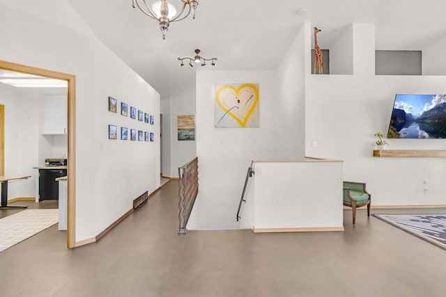 2301 Larkspur Ln, Great Falls, MT 59404 - corridor featuring baseboards, vaulted ceiling, and an upstairs landing