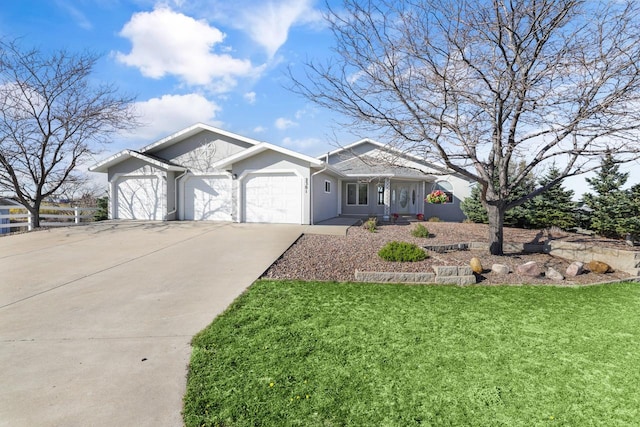 2301 Larkspur Ln, Great Falls, MT 59404 - ranch-style house featuring concrete driveway, an attached garage, a front yard, and stucco siding
