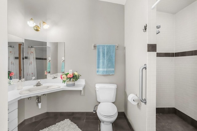 2301 Larkspur Ln, Great Falls, MT 59404 - full bath featuring a sink, tile patterned floors, a tile shower, and toilet