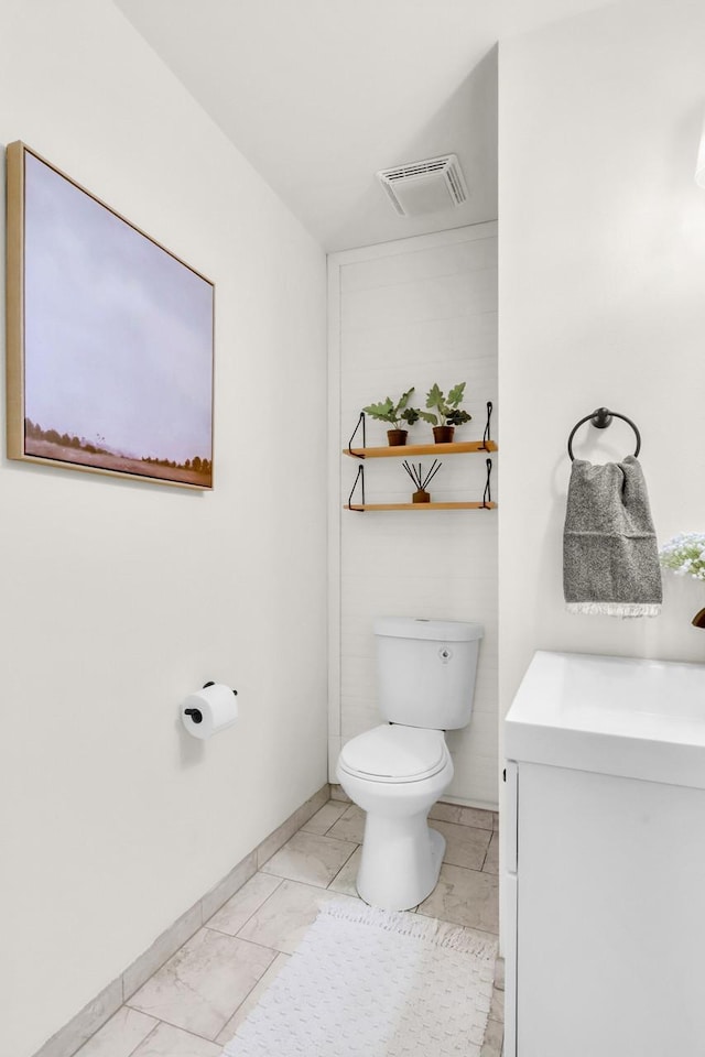 2301 Larkspur Ln, Great Falls, MT 59404 - bathroom featuring vanity, toilet, marble finish floor, baseboards, and visible vents