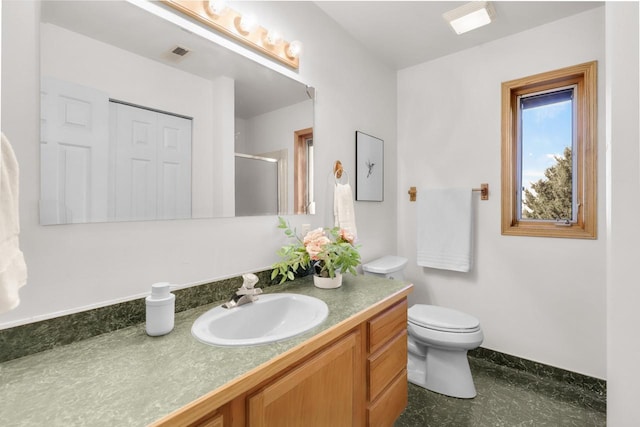 2301 Larkspur Ln, Great Falls, MT 59404 - bathroom with visible vents, a shower stall, toilet, and vanity
