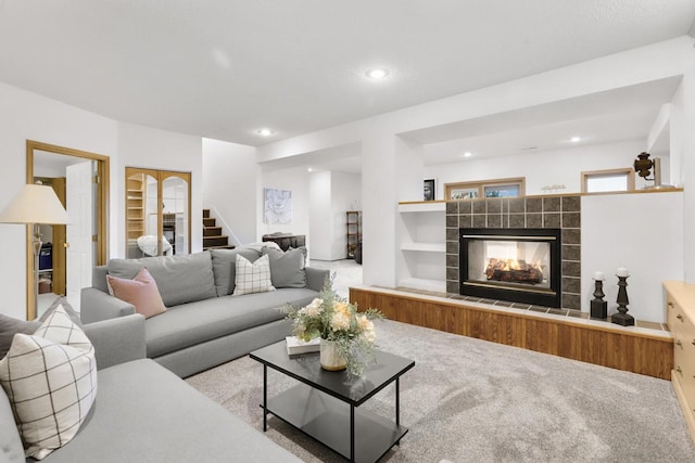 2301 Larkspur Ln, Great Falls, MT 59404 - living area with a fireplace, built in features, carpet, stairs, and recessed lighting