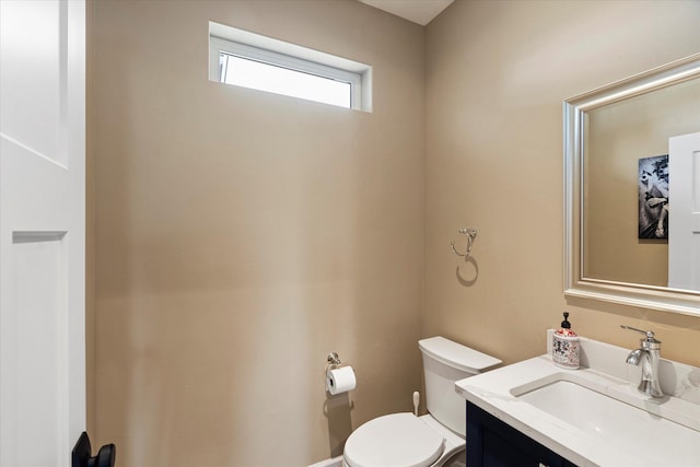 half bath with vanity and toilet