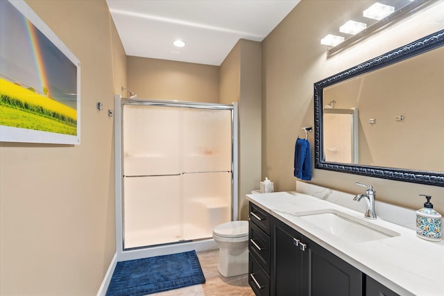 full bath with toilet, a shower stall, and vanity