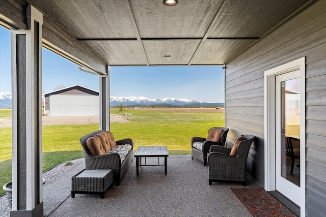 view of patio / terrace featuring a mountain view