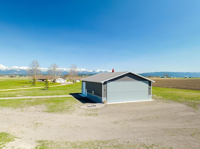 detached garage with a mountain view