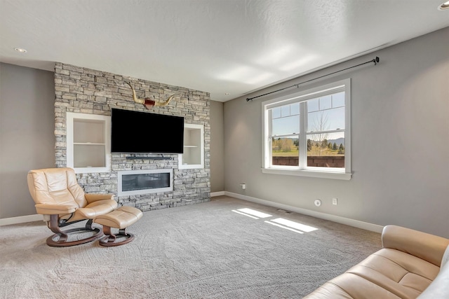 5010 Jeff Dr, Missoula, MT 59803 - living area with carpet floors, baseboards, and a fireplace